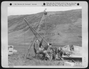 Members Of The 2Nd Service Group Hoist Salvaged Of A Wrecked Curtiss P-40 Onto A Truck, Somewhere In Iceland. 26 August 1943.